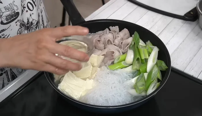 Add water and seasonings (except soy sauce and miso): Add water, sake, mirin, and sugar.