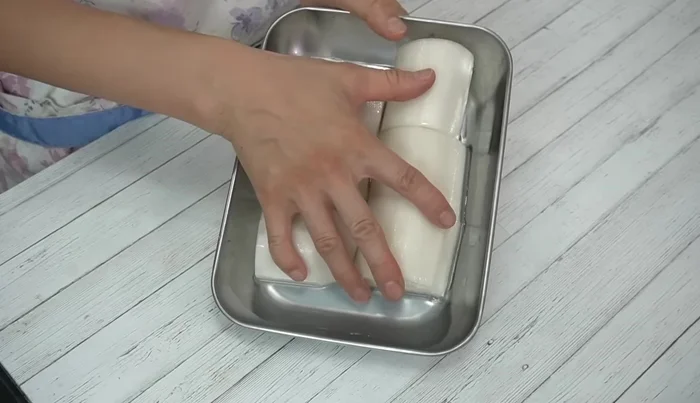 After 30 minutes, drain excess water from the salted radish. Wipe it dry with paper towels.