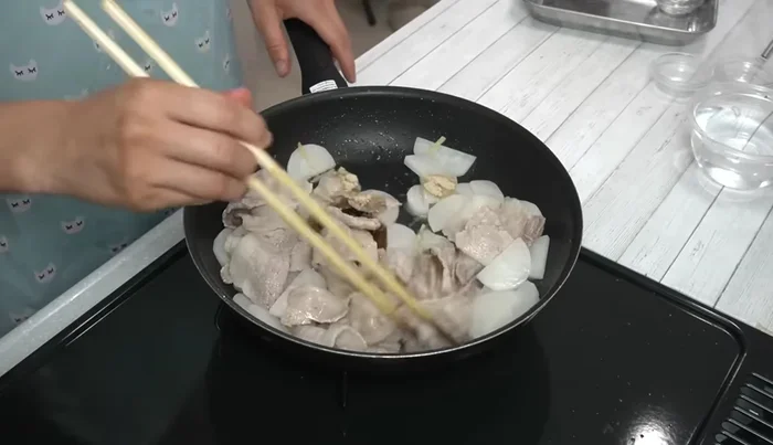 Add mirin and sugar, mix well, then add water and soy sauce. Mix thoroughly.