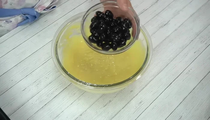 Add about 2/3 of the black beans to the batter and mix.