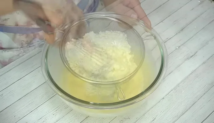 Add milk and mix well. Sift the pancake mix and add it, mixing thoroughly.