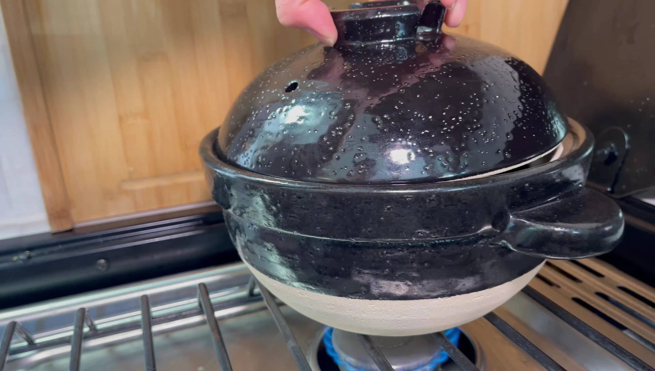 Seasoning a Japanese pot on a stove