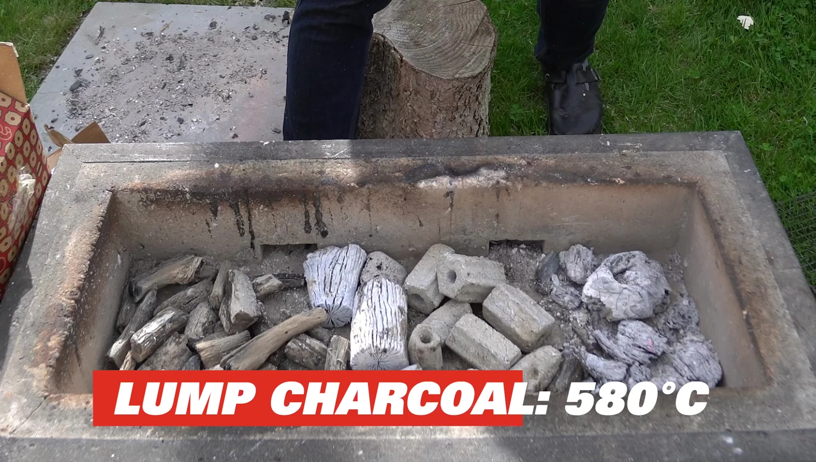 Three charcoal types burning in a grill.
