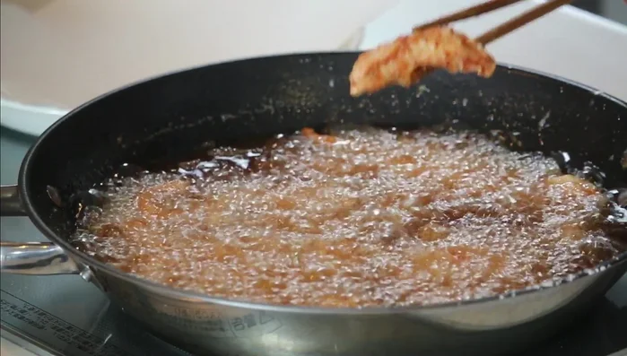 Remove chicken from pan and drain on a plate.