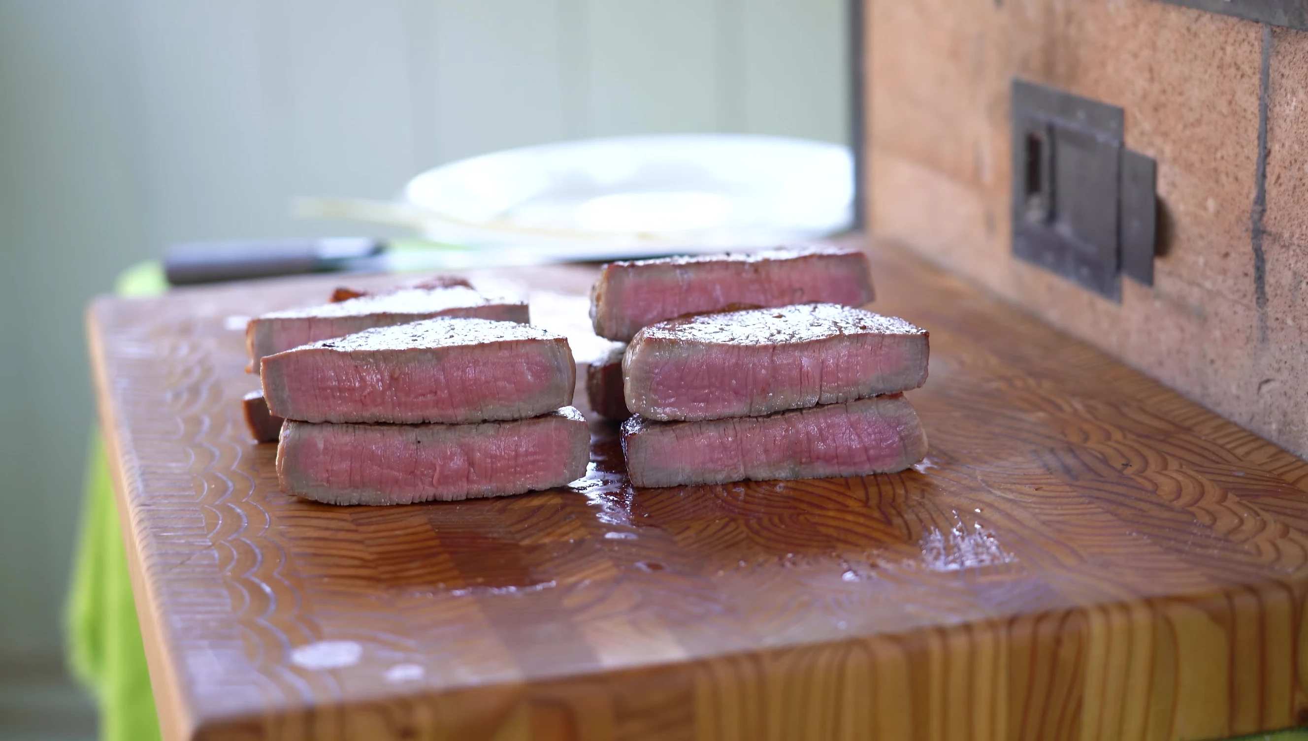Cooked steaks on wooden board