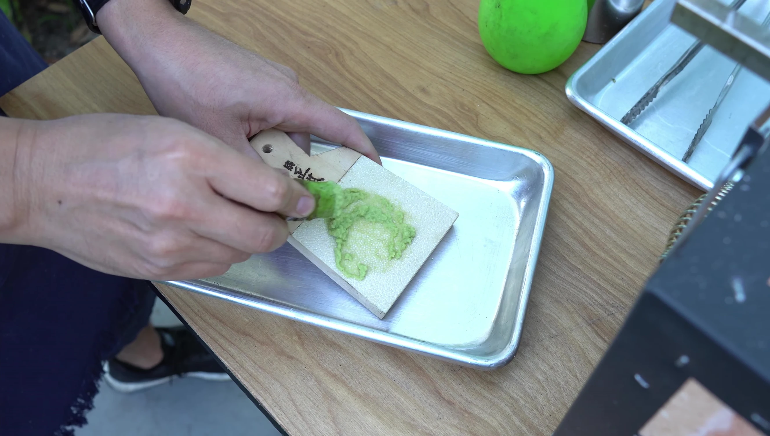 Fresh wasabi being grated for Wagyu.