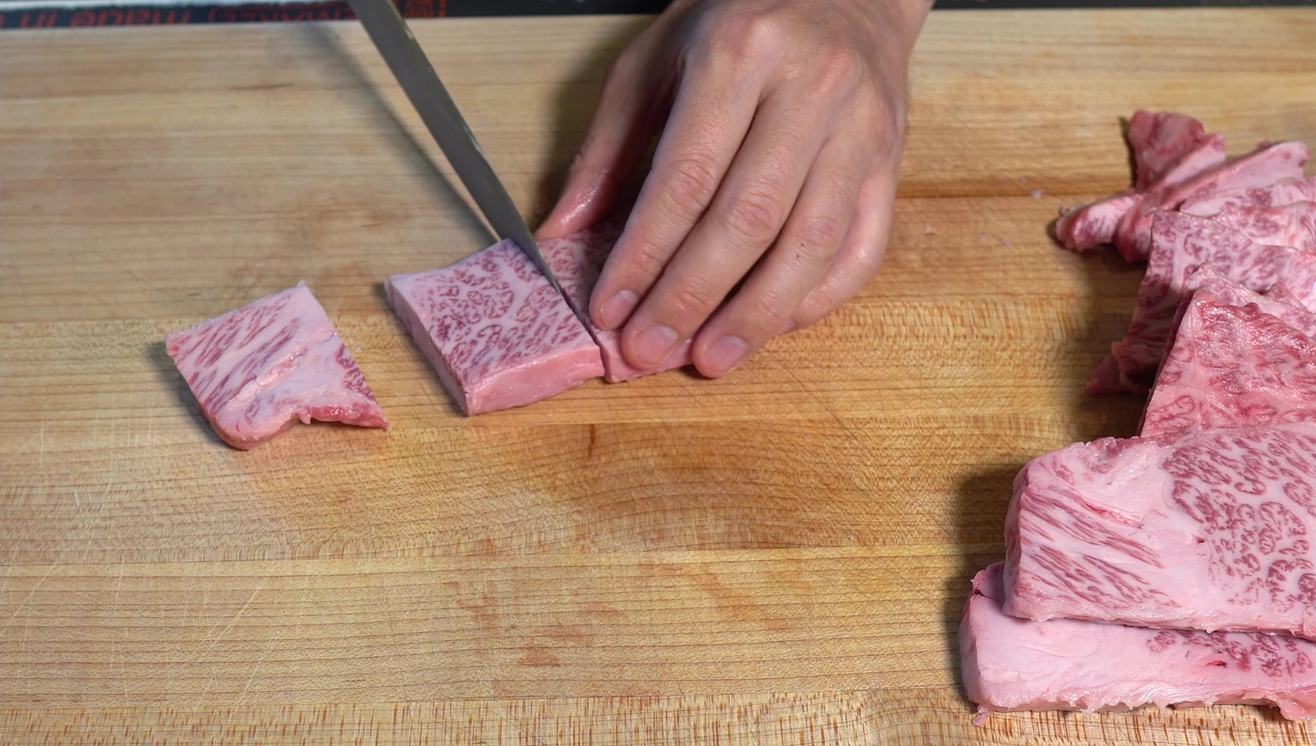 Slicing Wagyu beef for skewers