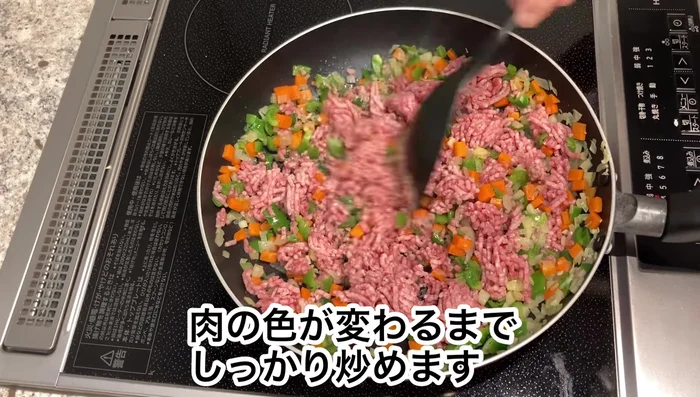 Add your chopped vegetables into the pan with the ground meat.