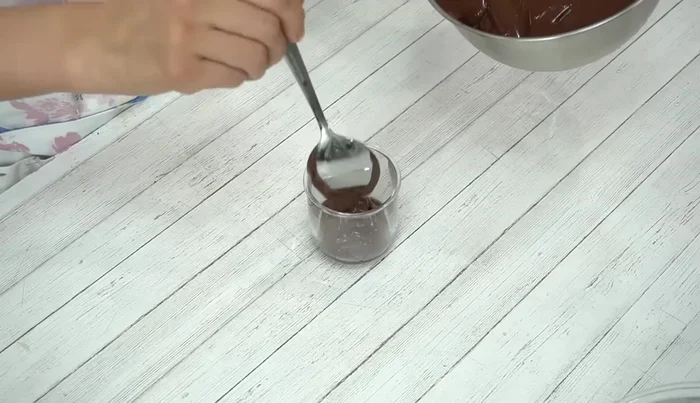Transfer the mixture into a container, smoothing the top surface.