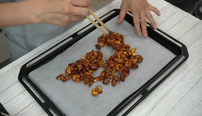 Pour the mixture onto the prepared baking sheet and spread it out to cool and harden. Refrigerate to speed up the process.