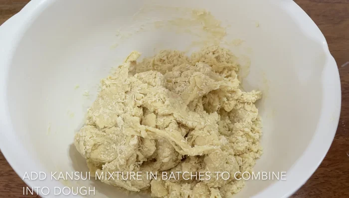 Add toppings, such as scallions, chashu, menma, and a soft-boiled egg.