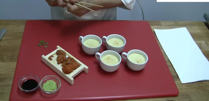 Garnish the steamed chawanmushi with uni and a little wasabi.