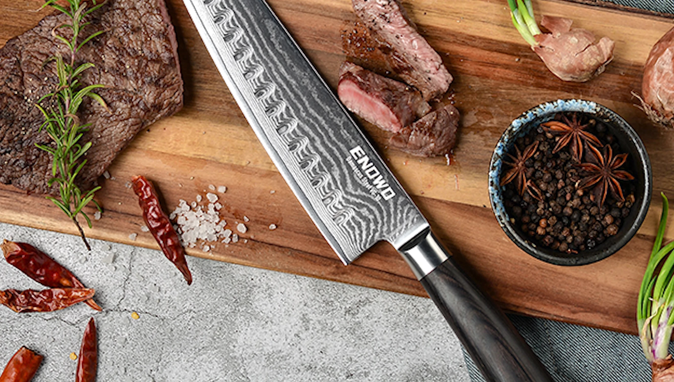Damascus sushi knife on wood board