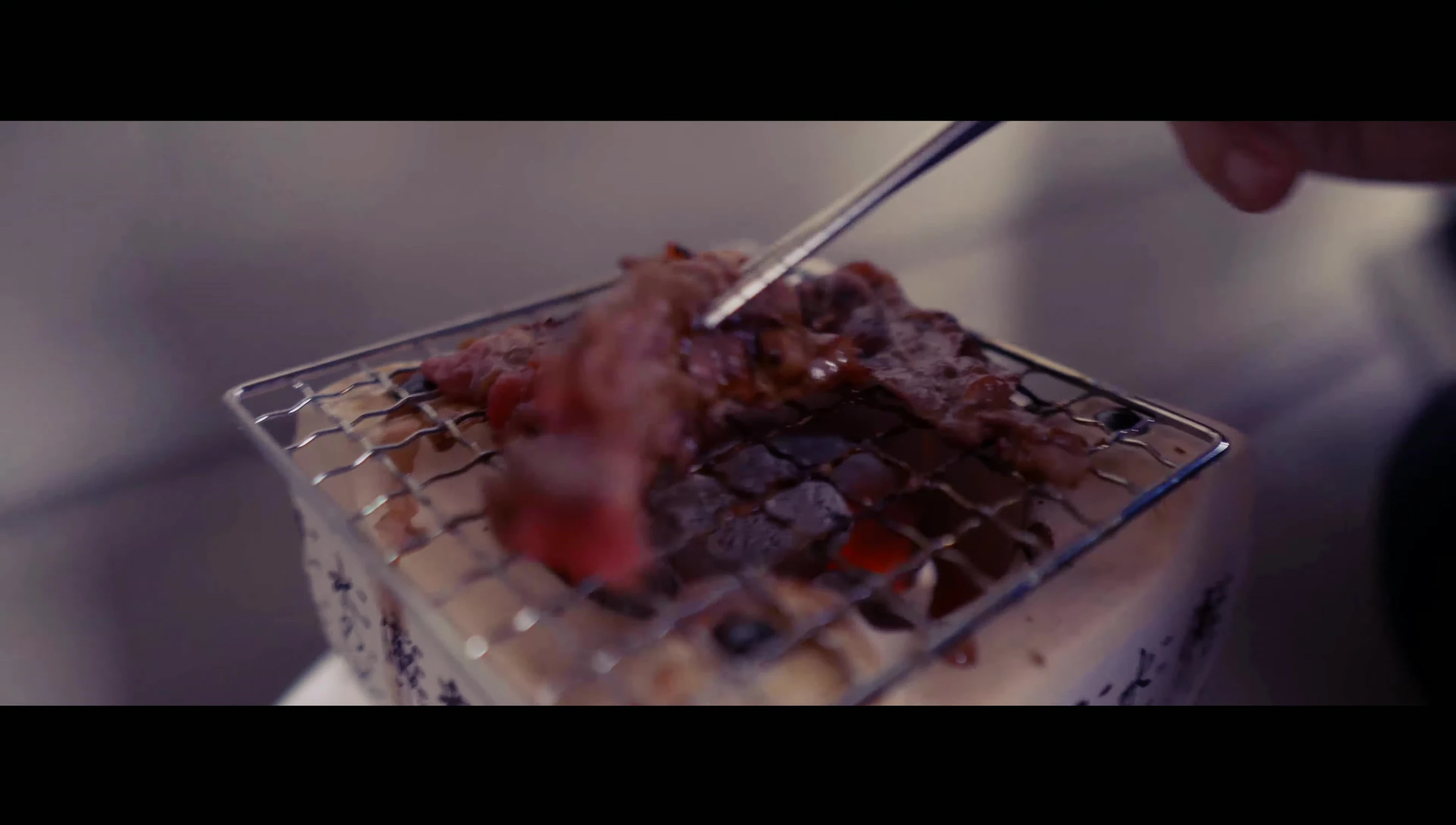 Korean short ribs grilling on mini grill