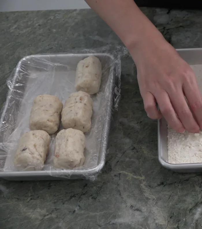 Bread the crab mixture: Coat with flour, then dip in egg, and finally cover with panko breadcrumbs.