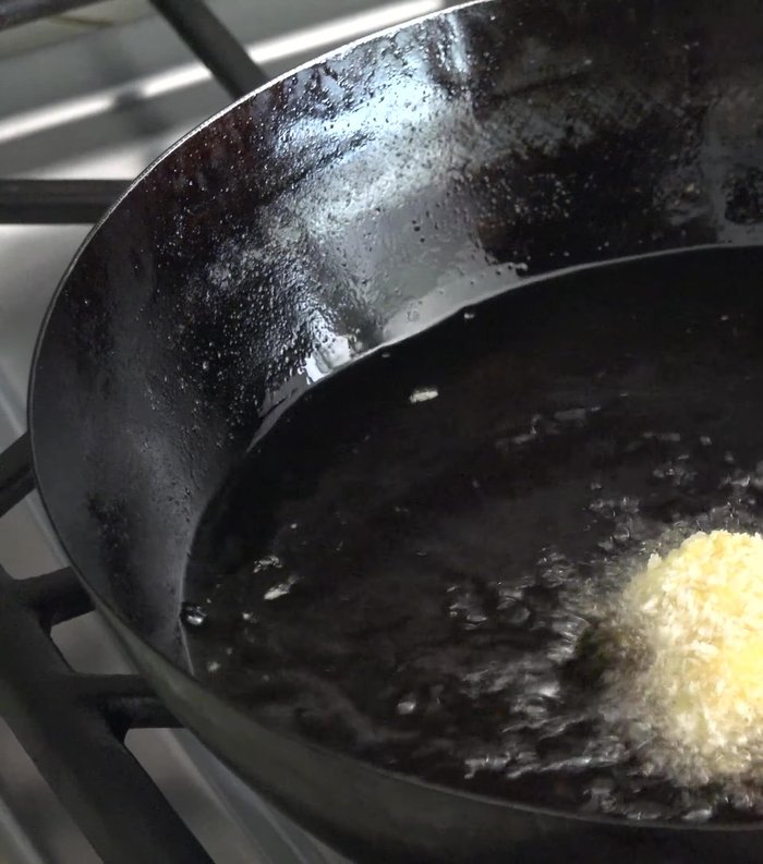 Heat frying oil at medium-high heat. Carefully drop the breaded crab mixture into the oil, one by one. You can use a deep fryer or pour oil over to cook the top faster.