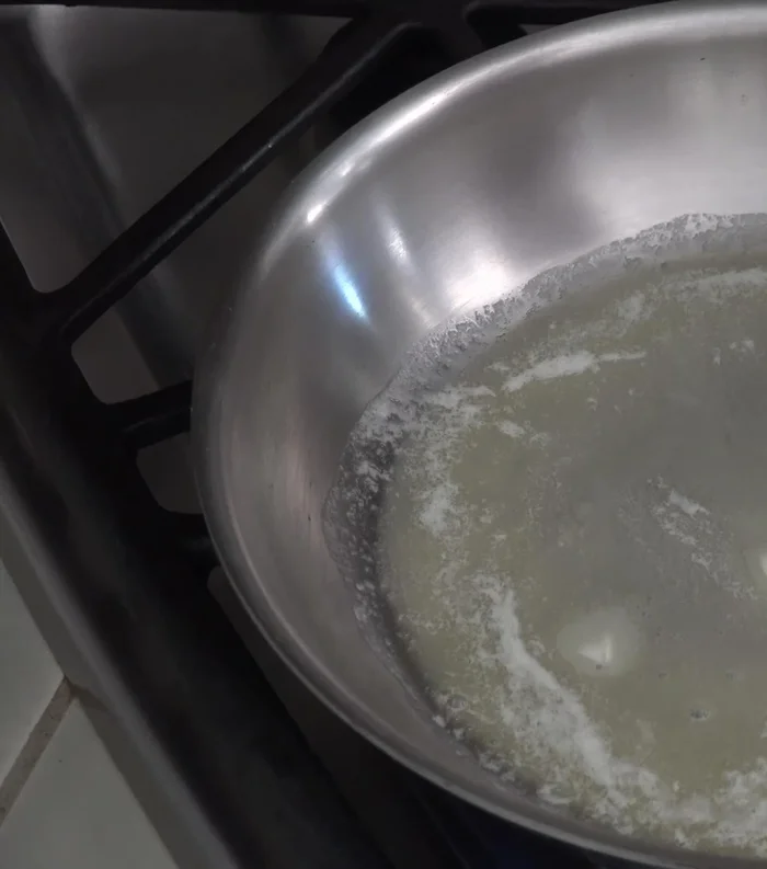 Make the béchamel sauce: Melt butter in a frying pan at medium heat. Add flour and cook for one minute until bubbling, stirring constantly.