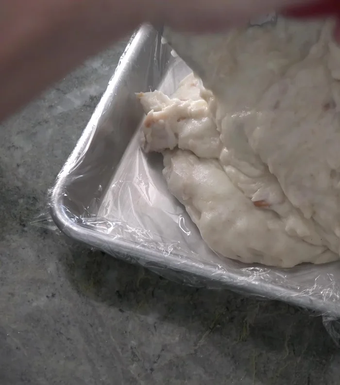 Spread the crab mixture on a plastic wrap-lined baking sheet, smooth the surface, and chill for an hour.