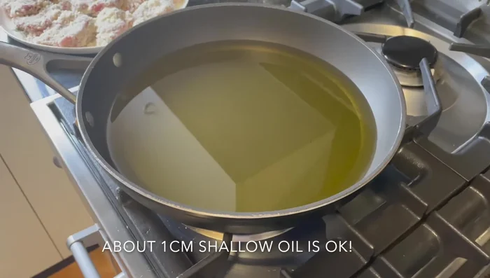 Heat the oil in a deep fryer or large pot to medium-high heat. Check readiness by inserting wooden chopsticks – bubbles should appear.