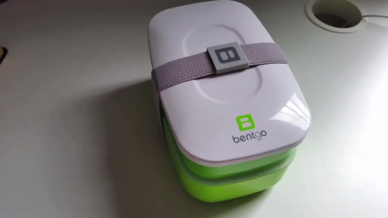The Bentgo lunchbox being opened to reveal its contents.