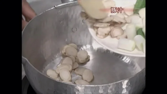 Prepare the Tonjiru (Pork Soup): Stir-fry burdock root until the oil penetrates.