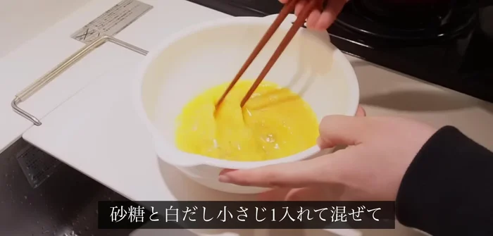 For tamagoyaki (rolled omelet): Whisk 3 eggs with sugar and about a teaspoon of white dashi. Fry in a pan, folding horizontally.