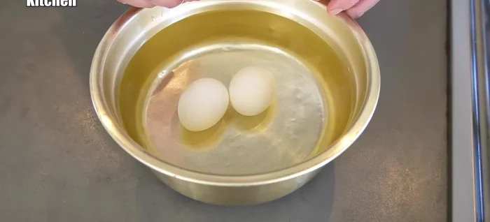 Peel the boiled eggs and set aside.