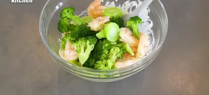Combine the cooked broccoli and shrimp with the tartar sauce.