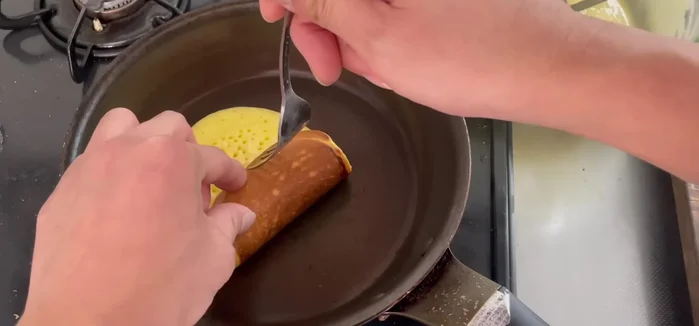 Wrap the dough around the anko, pressing lightly to seal.