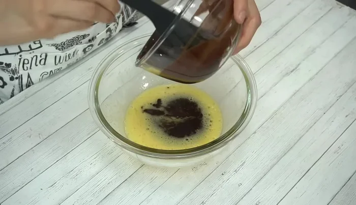 Add the melted chocolate-butter mixture to the egg mixture and mix well.