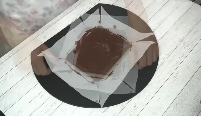 Remove the chocolate from the container, peel off the parchment paper, and cut into squares (approx. 2.5cm wide). Warm the knife in hot water for neat cuts.