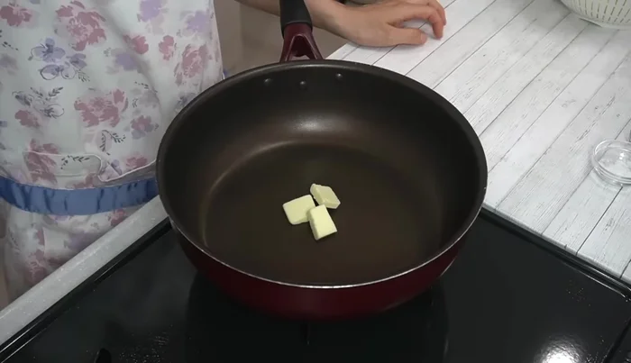 Melt half the butter in a frying pan over medium heat. Add the cabbage, salt, and pepper. Stir-fry until soft.