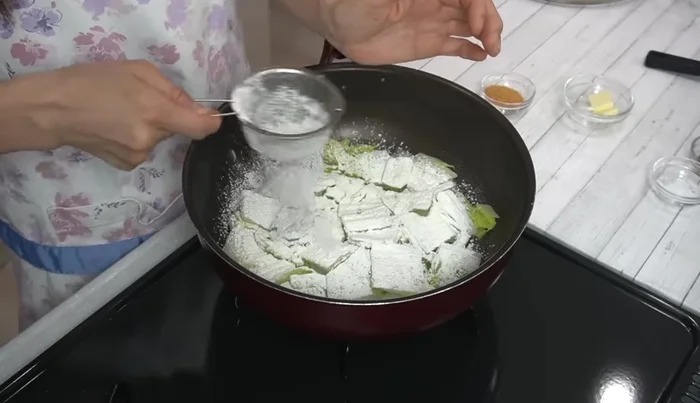 Turn off the heat. Sprinkle in the cake flour and mix well to prevent clumping.