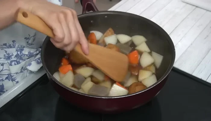 Add soy sauce, bring to a boil again, then reduce heat to medium. Cover and simmer for another 10 minutes, stirring occasionally.