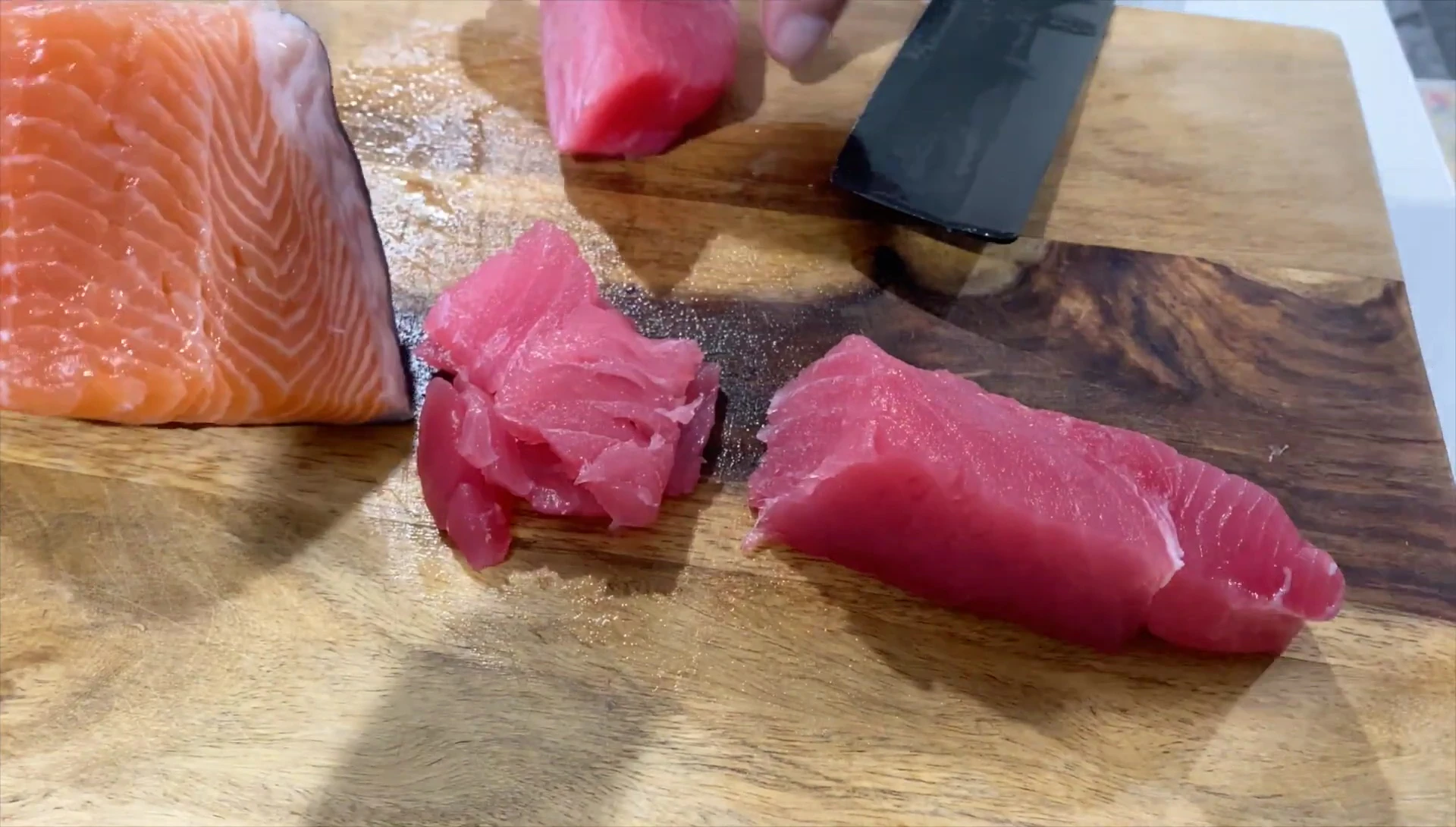 The skinned salmon being placed back in the fridge for later use.