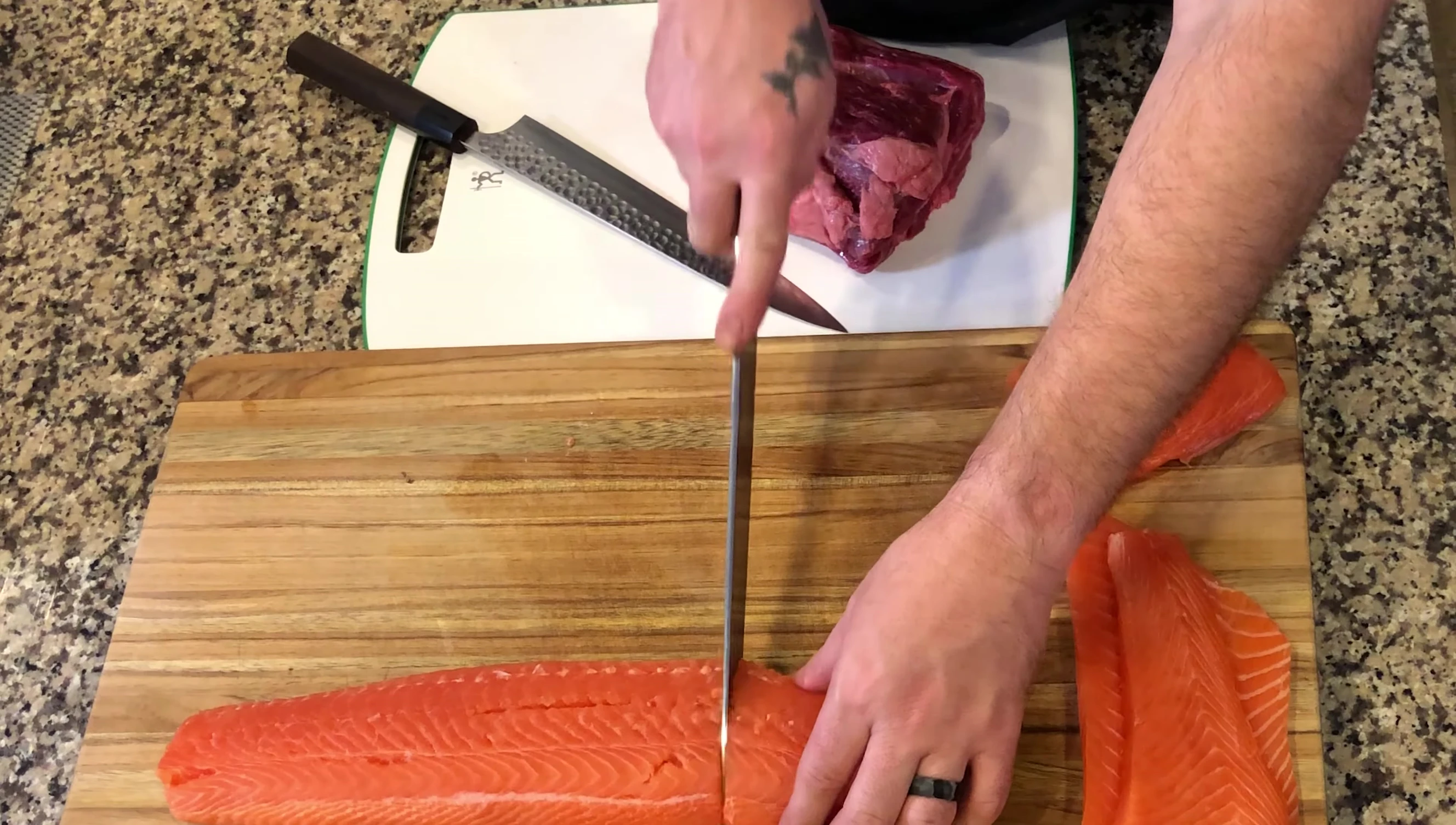 The Yanagiba knife creating paper-thin slices of fish.