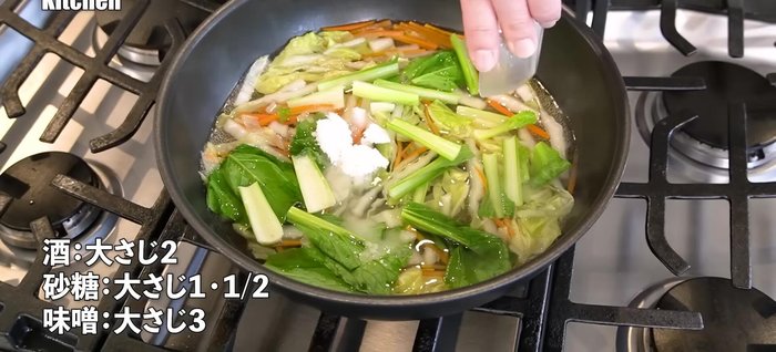 Add seasonings: sake, sugar, miso, and ginger.
