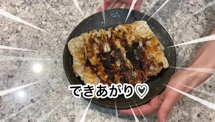 Cook the gyoza. (Detailed steps are missing from the provided transcript, please refer to the video.)