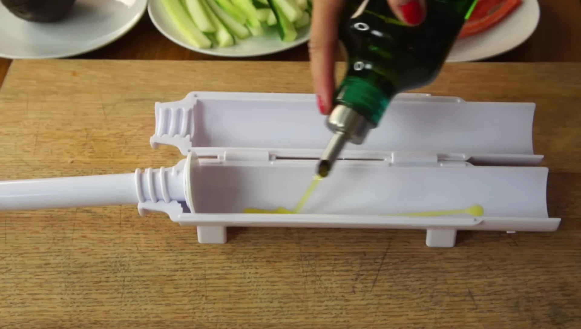 Oiling the plunger of the Sushi Bazooka.