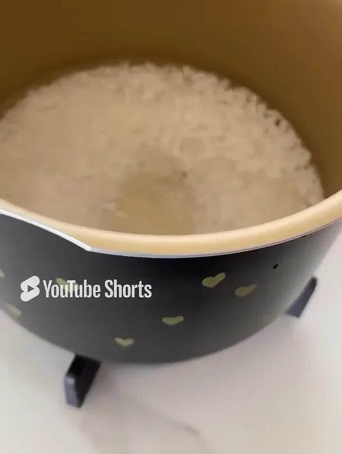 Cook the rice in a tall pan with two parts water (instead of 1.5 parts as indicated on packaging). Cook uncovered, then turn off the heat, cover, and let it sit for 10-15 minutes.