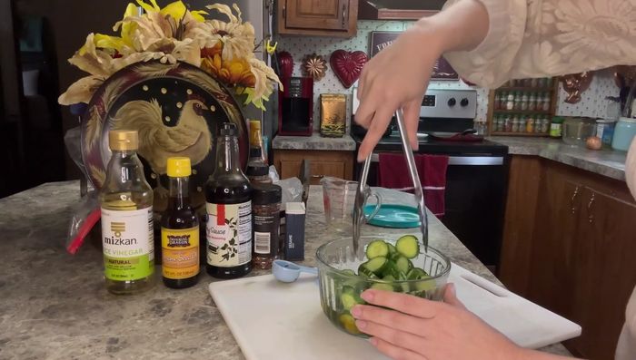 Pour the dressing over the cucumbers and mix well.