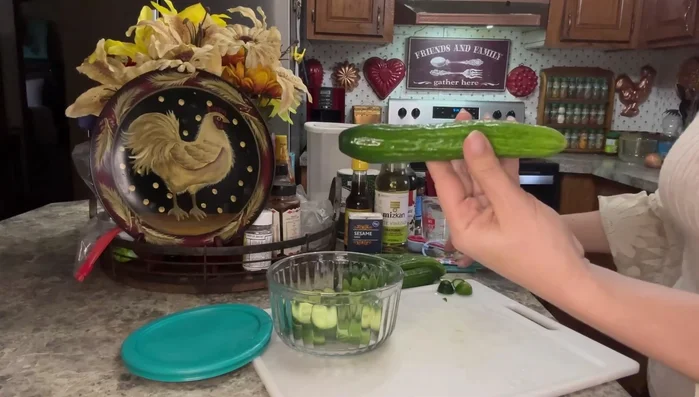 Cut cucumbers into coin-sized pieces.