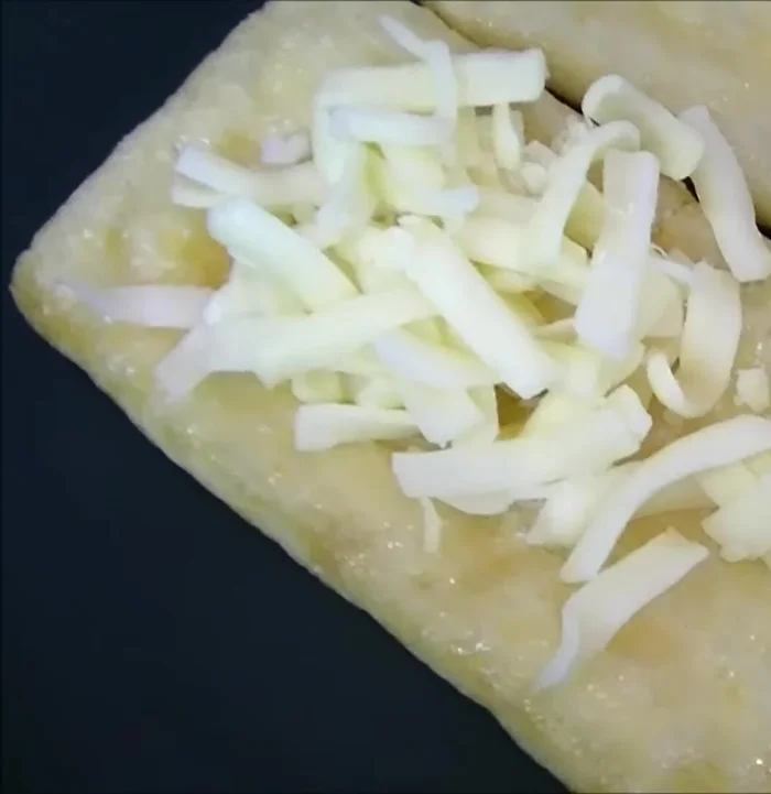 Place the other tofu pocket (cheese-less side down) on top to create a sandwich.