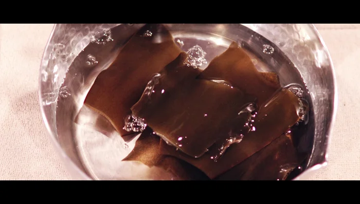Heat the kombu to make Dashi, remove before boiling. Add Bonito flakes and strain.