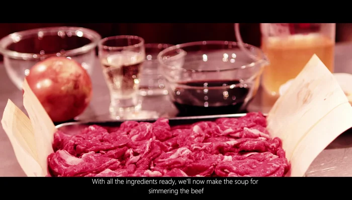 Prepare the Gyudon soup: Sauté onions until browned. Add the prepared Gyudon soup base (soy sauce, sugar, mirin, sake, and water).