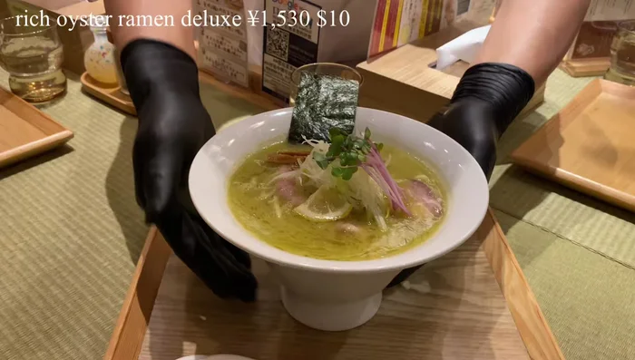 Prepare the Oyster Broth: This recipe relies heavily on a rich oyster broth. The video mentions a concentrated extract from Hiroshima oysters prepared with an original method. Precise instructions are not available from the transcript.