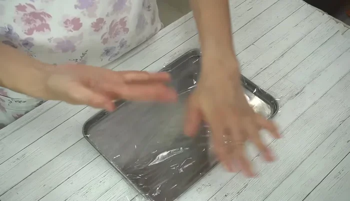 Divide the meat mixture into four equal portions and shape into patties, removing any air pockets to prevent cracking.