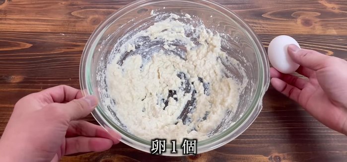 Add one egg to the crumbled tofu.