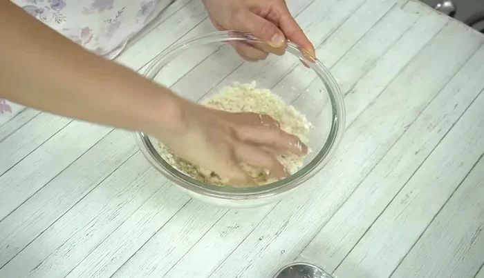 Knead the dough with your hands until it's firm and doesn't stick to your fingers. Adjust consistency with more tofu/water if too dry, or more egg whites if too wet.