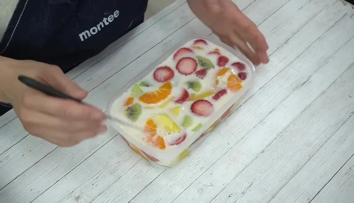 Once set, run a knife around the edge of the Tupperware, invert onto a plate, and gently remove the jelly.